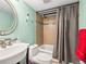 Bathroom featuring modern fixtures, a large mirror, and a shower/tub combo at 100 S Clarkson St # 202, Denver, CO 80209