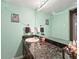 Bathroom featuring a modern sink, granite countertop, and framed mirror at 100 S Clarkson St # 202, Denver, CO 80209