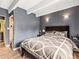 Bedroom with neutral gray walls and white ceiling beams at 100 S Clarkson St # 202, Denver, CO 80209