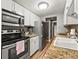 Modern kitchen with stainless steel appliances, granite countertops, and white cabinetry at 100 S Clarkson St # 202, Denver, CO 80209