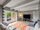 Bright living room with stylish furnishings, recessed lighting, and access to the outdoor balcony at 100 S Clarkson St # 202, Denver, CO 80209