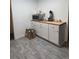 Bright kitchen featuring new cabinetry and countertops at 938 Racine St, Aurora, CO 80011
