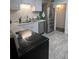 Bright kitchen featuring stainless steel appliances, white subway tiles, and ample counter space at 938 Racine St, Aurora, CO 80011