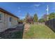 Spacious backyard featuring a small patio and wood fence, perfect for outdoor activities at 190 Hemlock St, Broomfield, CO 80020