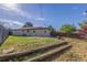 Large backyard with a grassy area and a wood fence on a sunny day at 190 Hemlock St, Broomfield, CO 80020