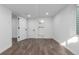 Finished basement featuring modern vinyl flooring and bright white walls, door, and trim at 190 Hemlock St, Broomfield, CO 80020