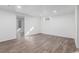 Unfinished basement with hardwood-style floors and natural lighting at 190 Hemlock St, Broomfield, CO 80020