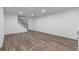 Large basement living area with hardwood floors and white walls at 190 Hemlock St, Broomfield, CO 80020