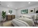 Bright bedroom with a large bed, stylish furniture, and natural light at 190 Hemlock St, Broomfield, CO 80020