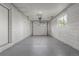 Spacious garage with block walls and an insulated garage door at 190 Hemlock St, Broomfield, CO 80020