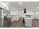 Bright, updated kitchen with stainless steel appliances, white cabinets, and wood flooring at 190 Hemlock St, Broomfield, CO 80020