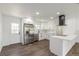 Kitchen with stainless steel appliances, white cabinets, and an island with a breakfast bar at 190 Hemlock St, Broomfield, CO 80020