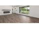 Living room with wood floors, a modern fireplace, and large windows for ample natural light at 190 Hemlock St, Broomfield, CO 80020