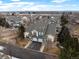 Aerial view of townhouses with lush landscaping, manicured lawns, and mature trees, creating a serene atmosphere at 4674 Flower St, Wheat Ridge, CO 80033