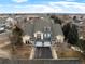 Aerial view of townhouses in a Gathering-friendly neighborhood with mature trees and well-maintained landscaping at 4674 Flower St, Wheat Ridge, CO 80033