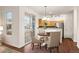 Dining area with sliding glass door leading outside, adjacent to the kitchen, providing a seamless indoor-outdoor flow at 4674 Flower St, Wheat Ridge, CO 80033