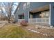 Back of home with white picket fence and sliding door providing a relaxed outdoor living at 4674 Flower St, Wheat Ridge, CO 80033