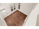 Bright living room featuring laminate flooring and two-story ceilings at 4674 Flower St, Wheat Ridge, CO 80033