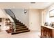 Basement staircase with dark wood and wrought iron railing at 335 Clayton St, Denver, CO 80206