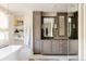 Bathroom with double vanity, ample storage, and marble countertops at 335 Clayton St, Denver, CO 80206