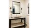 Stylish bathroom with contemporary vanity, vessel sink, and black framed mirror at 335 Clayton St, Denver, CO 80206