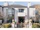 Stunning contemporary home with a black front door and manicured landscaping at 335 Clayton St, Denver, CO 80206