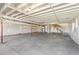 Unfinished basement with high ceilings, white walls, and a concrete floor at 2098 Peachleaf Loop, Castle Rock, CO 80108