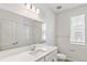 Well-lit bathroom with a large mirror, vanity, and shower at 2098 Peachleaf Loop, Castle Rock, CO 80108