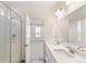 Elegant bathroom with double vanity sinks and glass-enclosed shower in the home at 2098 Peachleaf Loop, Castle Rock, CO 80108