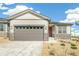 Charming single-story home with neutral siding, stone accents, a gray garage door, and low-maintenance landscaping at 2098 Peachleaf Loop, Castle Rock, CO 80108