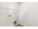 The spacious laundry room includes shelving, tile flooring, and hookups at 2098 Peachleaf Loop, Castle Rock, CO 80108