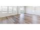 Living area featuring wood floors, bright windows, and sliding glass doors to the exterior deck with views at 2098 Peachleaf Loop, Castle Rock, CO 80108