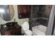 Bathroom featuring a vanity with a vessel sink and a tub with tiled walls at 6815 Hills Dr, Parker, CO 80138