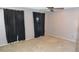 A vacant bedroom features neutral carpet, walls and black curtains at 6815 Hills Dr, Parker, CO 80138
