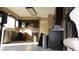 Kitchen with dark wood cabinets and stainless steel appliances at 6815 Hills Dr, Parker, CO 80138