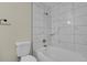 A tiled bathroom with a shower and tub combination at 14308 E Whitaker Pl # 114, Aurora, CO 80015