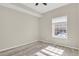Comfortable bedroom boasts natural light, neutral tones, and modern flooring at 14308 E Whitaker Pl # 114, Aurora, CO 80015