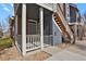 Charming exterior with blue siding, brick accents, and private entrance at 14308 E Whitaker Pl # 114, Aurora, CO 80015