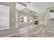 Well lit living room with fireplace, windows, and wood floors at 14308 E Whitaker Pl # 114, Aurora, CO 80015