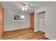 Bright empty bedroom featuring wood-look flooring, a window, a closet, and fresh paint at 2211 Sherman St, Longmont, CO 80501