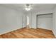 Empty bedroom with wood floors, ceiling fan, window, and closet at 2211 Sherman St, Longmont, CO 80501
