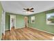 Spacious bedroom features wood flooring, multiple doors, and a bright window at 2211 Sherman St, Longmont, CO 80501
