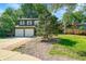 Charming two-story home with a two car garage, well-manicured lawn and mature trees at 2211 Sherman St, Longmont, CO 80501