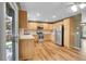 Bright eat-in kitchen with stainless steel appliances, wood cabinets, and sliding doors to the backyard at 2211 Sherman St, Longmont, CO 80501