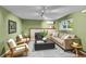 Inviting living room with a fireplace, plush seating, and a large window for ample natural light at 2211 Sherman St, Longmont, CO 80501