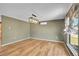 Inviting living room featuring hardwood floors, a modern light fixture, and bright, natural light at 2211 Sherman St, Longmont, CO 80501