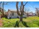 Backyard view showcasing the exterior of the home with a small patio area at 4740 Milwaukee St, Denver, CO 80216