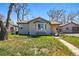 Charming single-story home with a bay window and well-maintained lawn at 4740 Milwaukee St, Denver, CO 80216