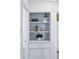 Hallway shelving featuring artistic decor and stylish storage solutions at 4740 Milwaukee St, Denver, CO 80216