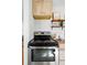 Close-up of a stainless steel oven and cooktop, highlighting the kitchen's modern appliances at 4740 Milwaukee St, Denver, CO 80216